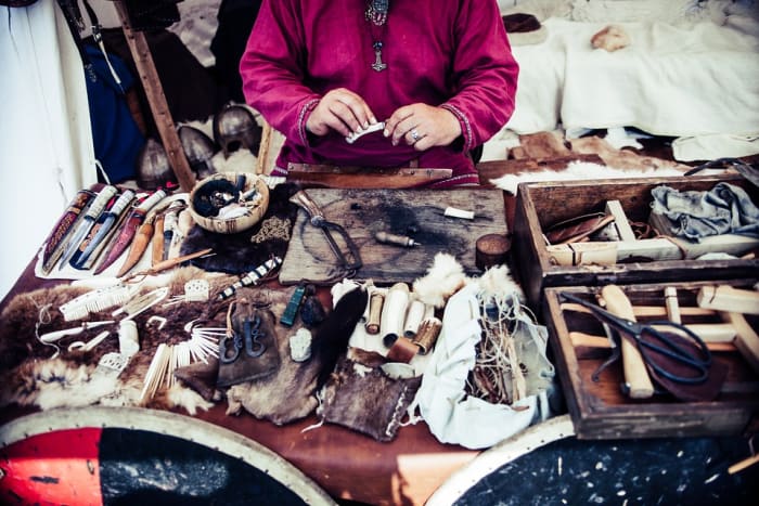 Native American leather crafting tools and materials used to make moccasins, shirts, breeches, and dresses.