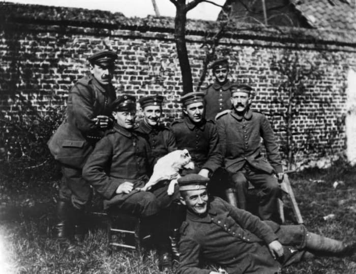 WW1: Adolf Hitler, aged 25, (seated far right) with his war comrades of the Bavarian Reserve Infantry Regiment 16.