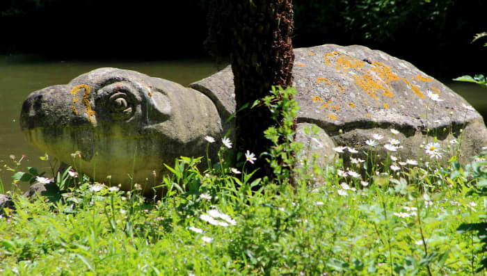 A lichen covered Dicynodon lacerticeps lurks in the undergrowth by the water's edge. Note the turtle-like carapace which the creature never had in real life