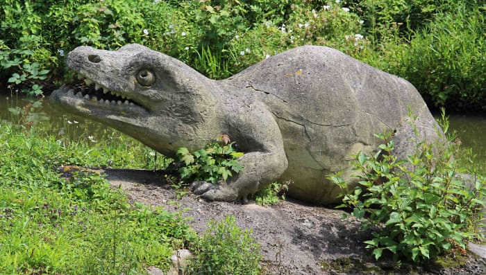 Labyrinthodon salamandroides at the water's edge. Reconstruction of these amphibians was based solely on the fossilised skull - all that was known at the time