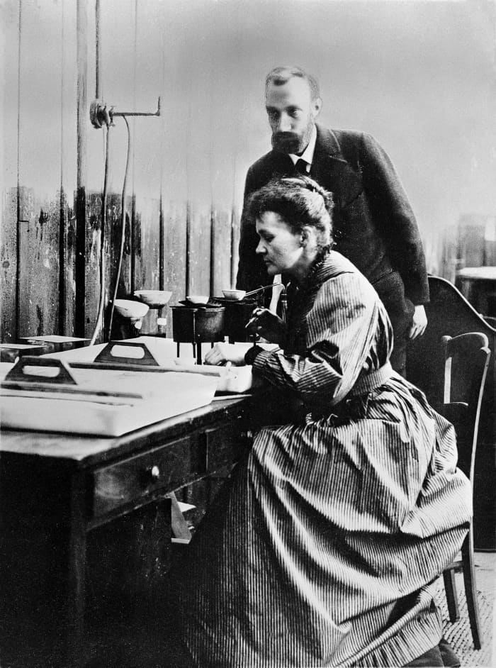 Marie and her husband Pierre in a laboratory.