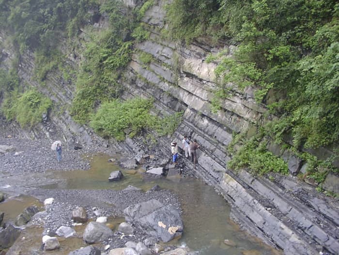 Researchers studying the Doushanto Formation in the Yangtze Gorges area, South China.