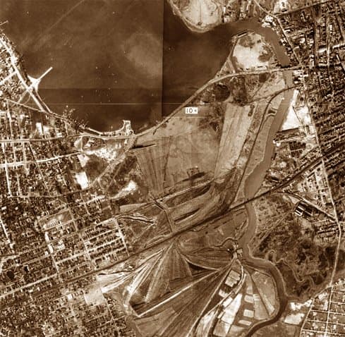 The Flushing River valley. The river is to the right, the vast Corona Ash Dumps to the left. This early aerial photo was taken around 1915, prior to the building of Roosevelt Ave