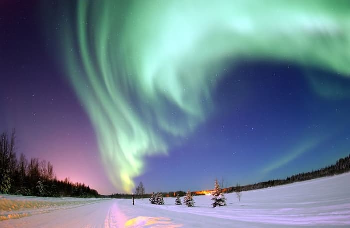 Plasma ejected from the surface of the Sun interacts with the Earth's atmosphere to cause the Aurora Borealis, or Northern Lights.