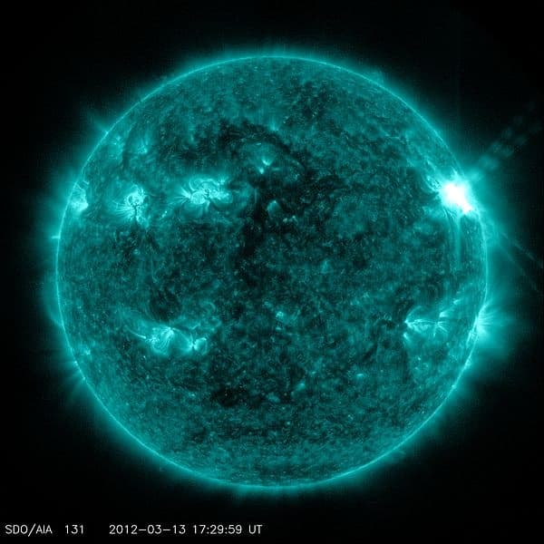 Seen through special filters, solar flares are intense bursts of radioactivity closely associated with sunspots. Sunspots are caused by variations in the magnetic field.