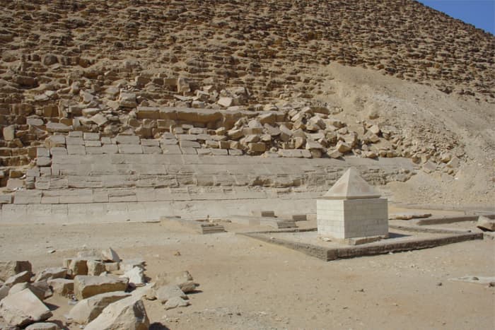 The capstones (tips) of pyramids and obelisks were referred to as "benbenet" by the Egyptians, indicating a connection with the Benben stone. This particular capstone once topped the Red Pyramid at Dahshur, beside which it now stands on display.