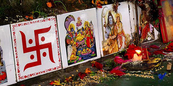 A right pointing swastika seen here with other decorative religious imagery - this swastika symbol is revered by hundreds of millions of Hindus throughout the world