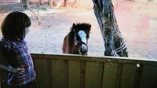 One of the children with a pet pony. The boys admitted to torturing animals.