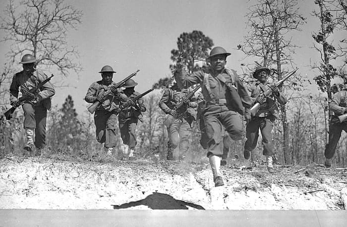 Sgt Franklin Williams leading his platoon in a charge at Fort Bragg