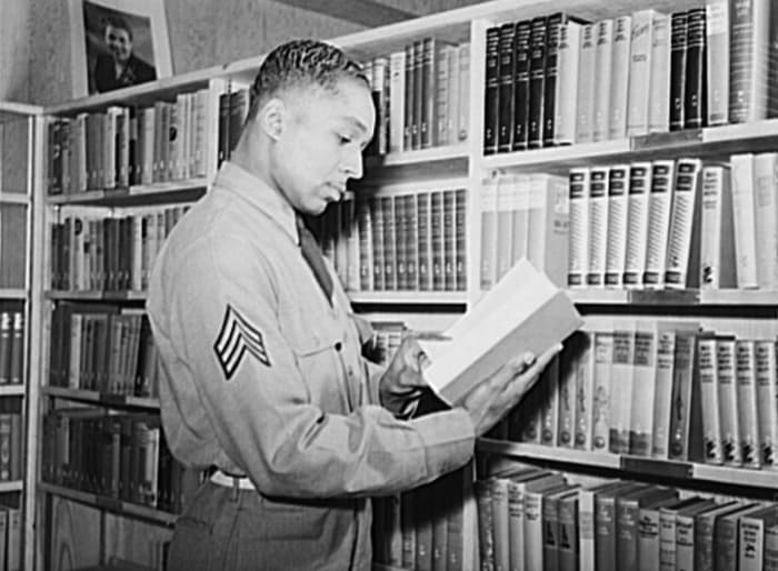 Sergeant Williams in the library of the service club at Fort Bragg, NC
