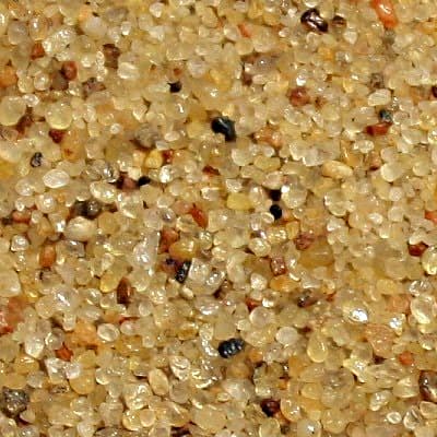 'Typical' quartz sand. Note the predominant colour of the sand, but also note the variety of other minerals in the sample