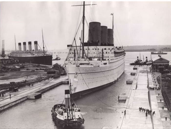 1930s. RMS Olympic behind RMS Empress of Britain, one of the newer, larger, more modern liners Titanic's sister began loosing money to by this time.