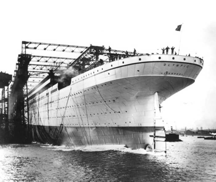 The launch of Olympic. Traditional with lead ships of a class, the hull was painted a light grey so that her features would stand out in photographs.