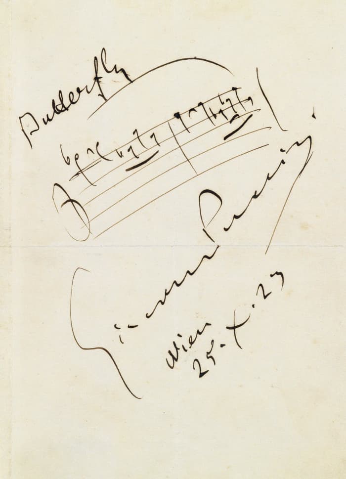 Notation of the opening of the aria 'One Fine Day' with Puccini's signature.