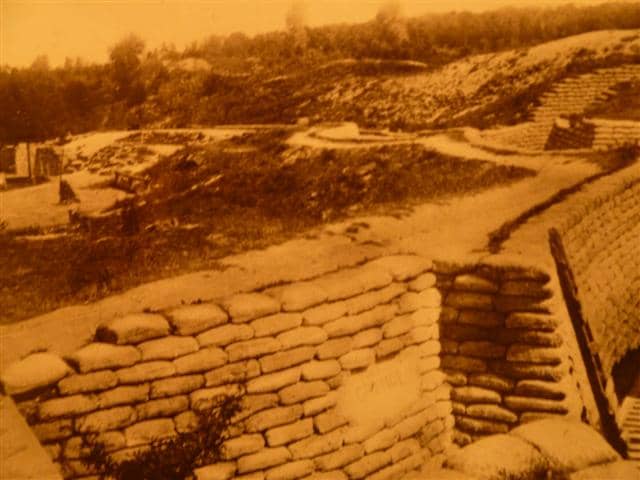 Photograph of an old postcard showing a section of restored Canadian trenches at Vimy