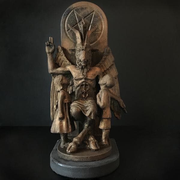 The statue of Baphomet features two young children seeking knowledge..