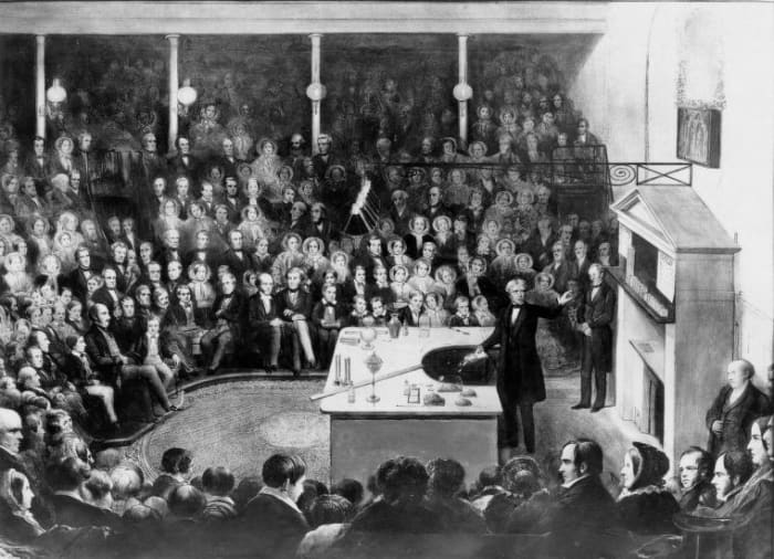 Faraday shown delivering the British Royal Institution's Christmas Lecture for Juveniles during the Institution's Christmas break in 1856