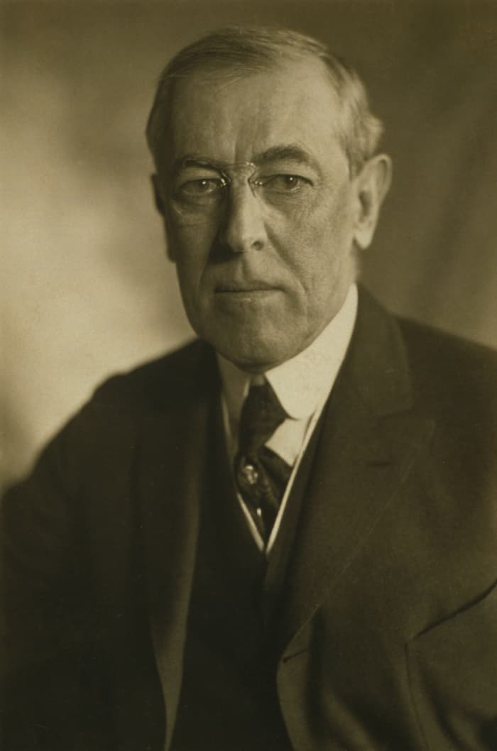 American progressives like Woodrow Wilson believed that American government experts should abandon some of its constitutional principles like that of national independence.