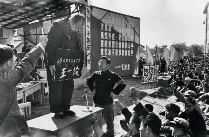 A struggle session where people were encouraged to "struggle" against counter-revolutionary elements to make them admit to their crimes : psychologically damaging and humiliating at best, and conducive to physical violence at worst.