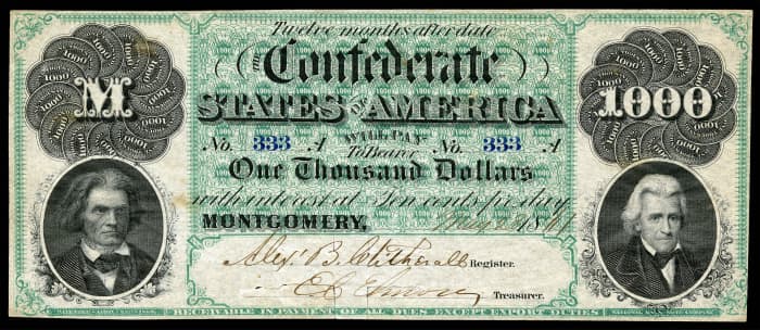 A $1000 bank note from the Confederate States of America, dated 1861. It features the portraits of John C. Calhoun at left, and Andrew Jackson at the right.