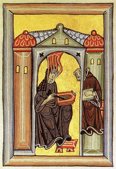This frontispiece image from Scivias depicts Hildegard receiving divine revelations in the company of Volmar, her monk secretary. She holds a wax tablet and stylus.