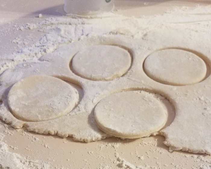 Use a small cup to cut circles out of the dough and then press them into the mini cupcake tins.