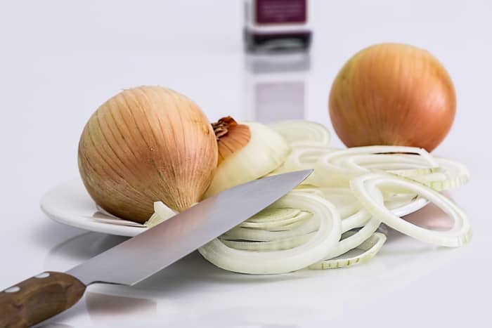 Cutting onions produces sulphur gas, which irritates the eyes and causes the release of reflex tears