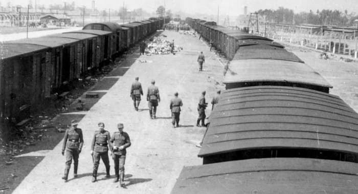 Unloading area, Auschwitz - the crematoria smokestacks are visible in the distance.