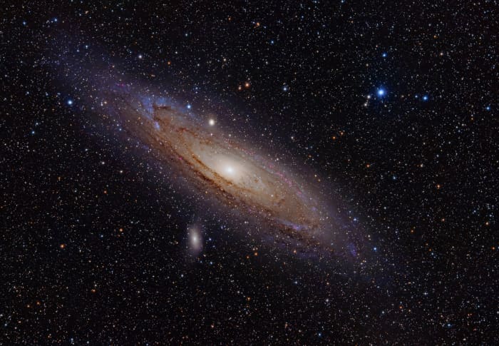 We live in the Milky Way galaxy. The Andromeda Galaxy is the nearest galaxy to Earth at about 2.5 million light years. It contains about one trillion stars.