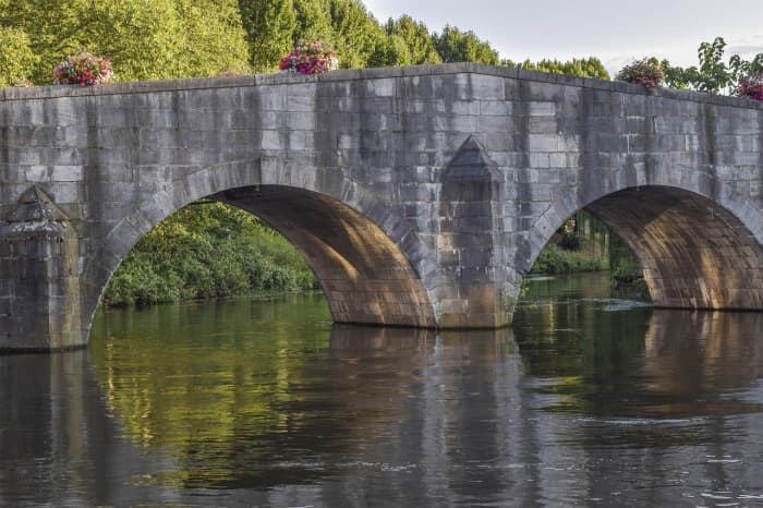 Arches are really strong and can take a lot of load pushing down on them. Before steel bridges were invented, arch bridges made of stone were more common.