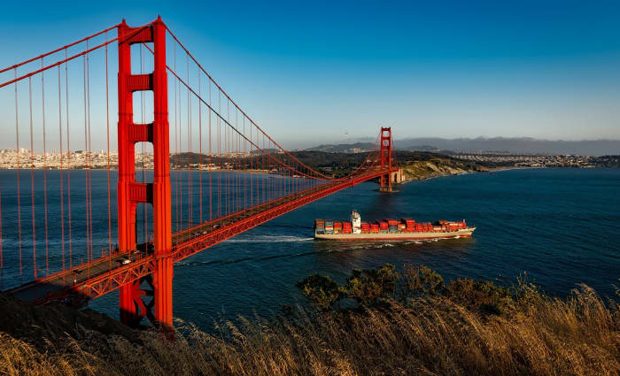 The Golden Gate Bridge in San Francisco, USA is a suspension bridge. Thick steel cables hold up the roadway between the tall steel pillars.