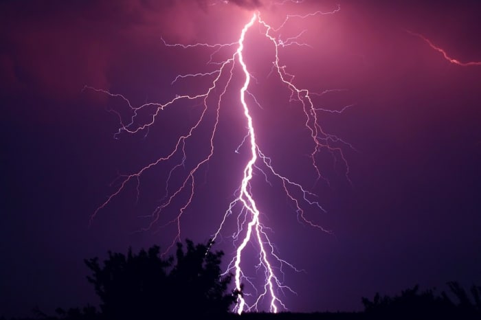 During a thunderstorm, clouds get charged up. When the charge and voltage becomes too great, a spark jumps from cloud to ground. We call this lightning.