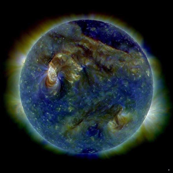 This image is a computer composite showing the effects of a solar eruption on the earth's magnetic field