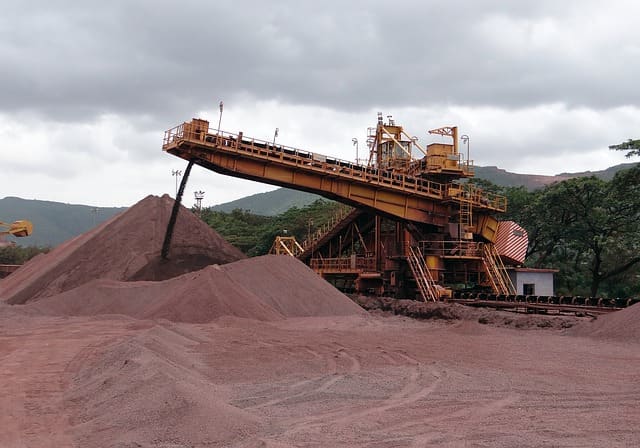 An operative iron ore mine. Ore minerals of every kind are extracted from the earth in vast quantities and used in manufacture and industry.