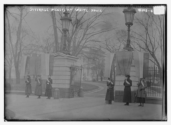Women picketing outside of the White House and were arrested and sentenced to jail time