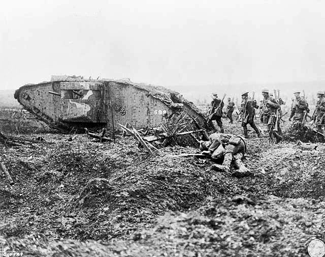 The weapons of warfare at the start of the 20th Century were changing with more lethal consequences - Mark II tank with Canadian infantry at Vimy Ridge, 1917