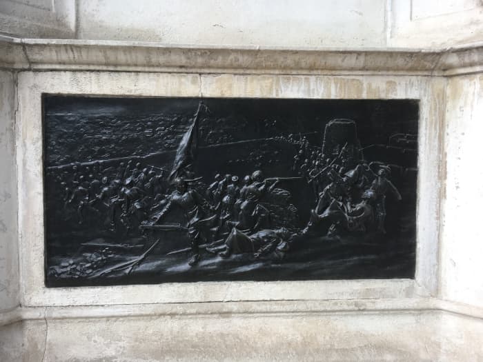 Bronze relief on the memorial showing the Boxer Rebellion - the US Marine figure is seen on the right with the distinct uniform and headgear apart from the Royal Marines