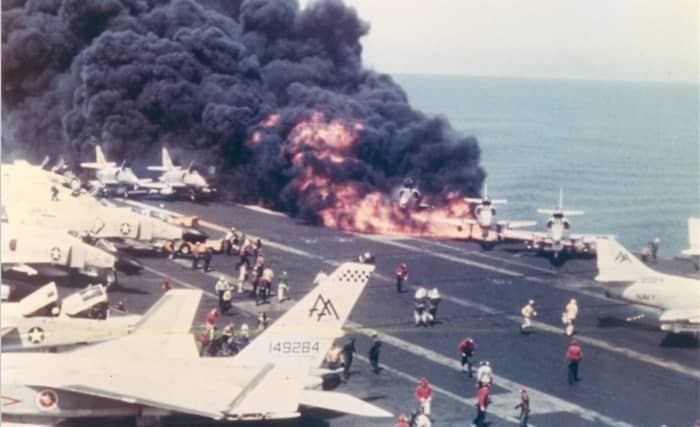 July 29, 1967 - A4s already on fire on the deck of the Forrestal, moments before the devastating explosion. McCain's A4 is third from the right, nearly engulfed.