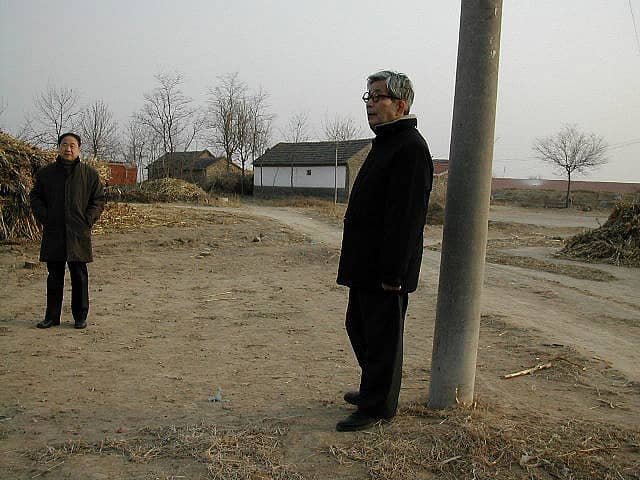 Mo Yan, at left, among the wintry sorghum fields of Shandong that look a lot like Kansas, dreaming up other ¨other concerns¨ for your amusement and edification.