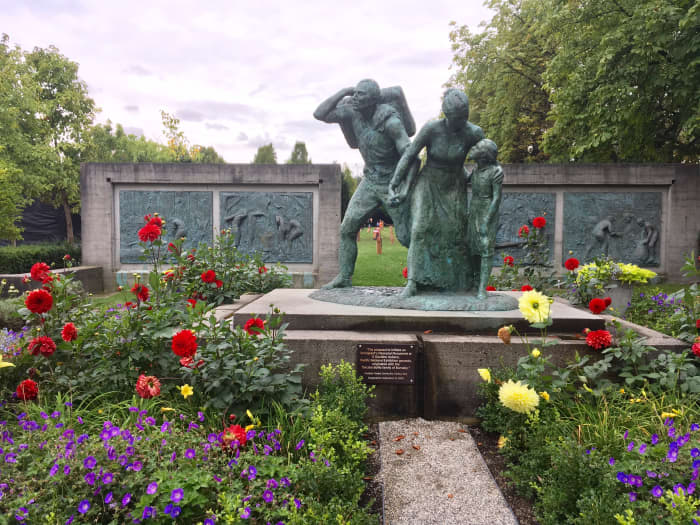 The Immigrant's Memorial Monument by Sergio Comacchio; the main dinosaur exhibit was located on the lawn behind the monument