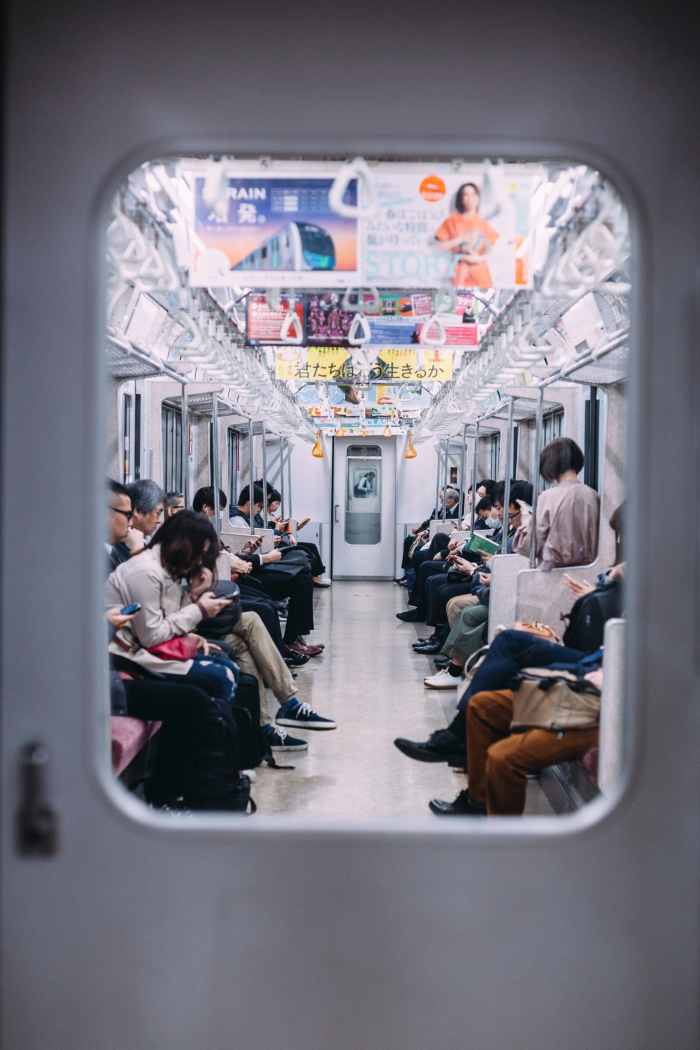 Japan's lonely subway ride. Some people might say this snapshot looks like that of any other subway in the world. The reality is that this exact scene repeats itself millions of times daily. No one talks; not a stare; total respect of others' space.
