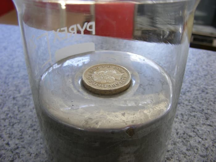 A coin floats in mercury because the density of the metal that the coin is made from is less than that of mercury.
