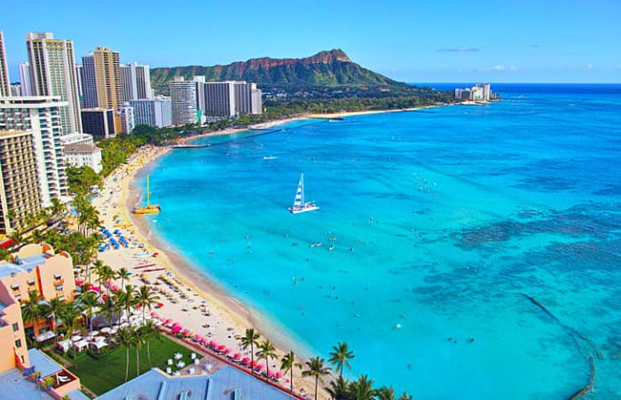 Waikiki Beach, Honolulu: This neighborhood on the southern shore of Honolulu is known for its high-end resorts, entertainment, shopping, and dining, as well as its gorgeous beaches.