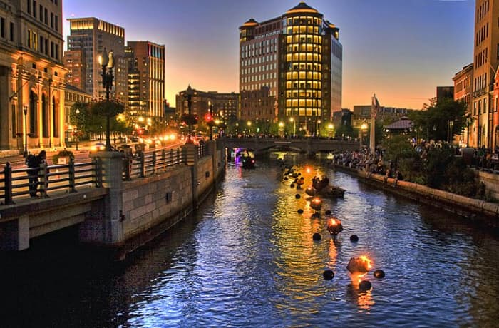 WaterFire Providence: more than 100 bonfires are lit in large iron pans in the river's center and kept blazing throughout the evening as residents and tourists stroll along the brick riverside walkways and footbridges. Photo by liz west via Flickr.