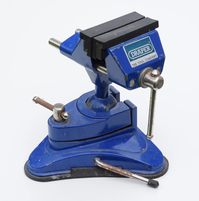 A small vice like this one is useful for holding components such as connectors when soldering. This vice has a suction base to hold it securely onto a smooth surface like a countertop.