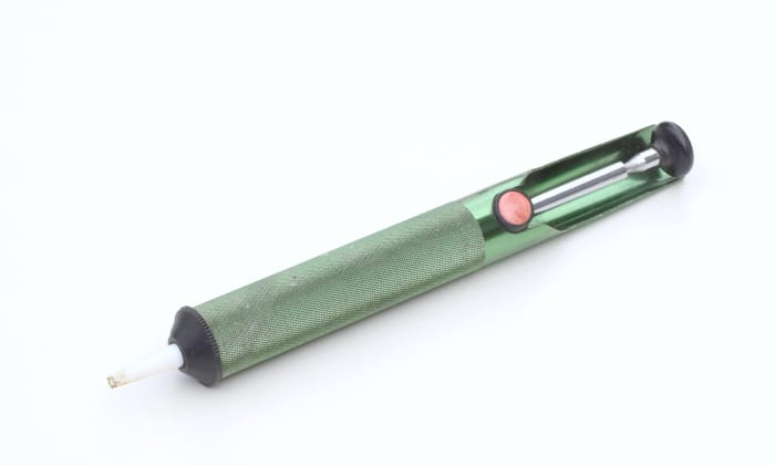 De-soldering pump or "solder sucker" for sucking up molten solder when de-soldering components.