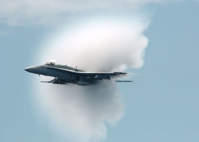 Sometimes sonic booms are visible: the high pressure area can cause water vapour to condense, briefly forming a cloud around the plane.