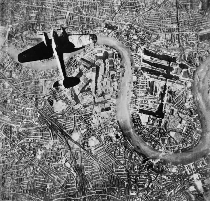 A Heinkel He 111 bomber over London on 7 September 1940, the loop in the Thames visible. The docks at the Isle of Dogs and Wapping are probably its target.