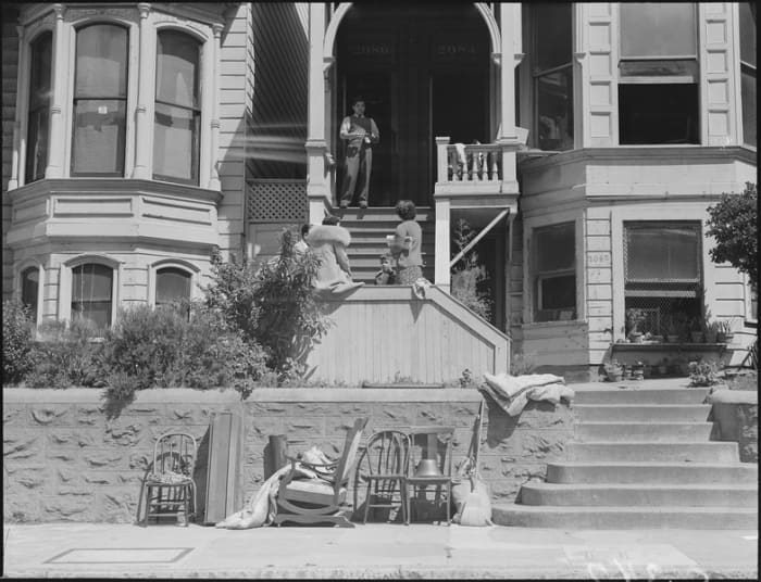 WWII: A Japanese family awaits "evacuation" to a "relocation center" in San Francisco. April 29, 1942.