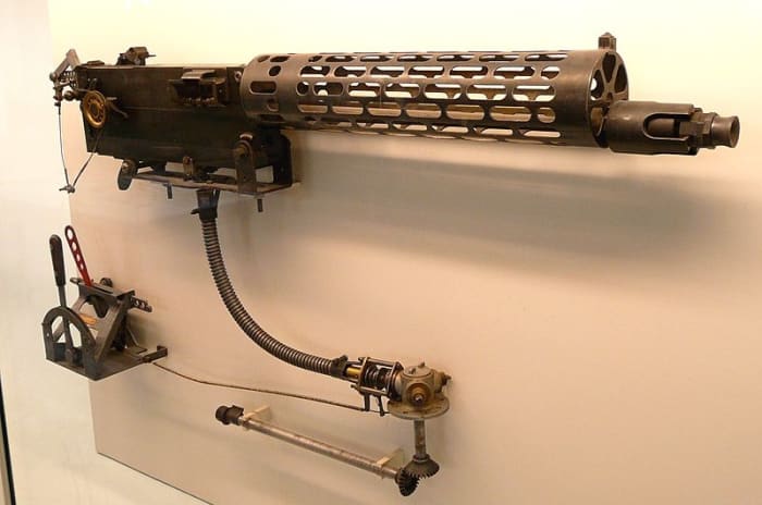 World War 1: The standard German MG 08 machine gun modified for use on fighter planes. Note the air-cooled slotted jacket, the synchronization gear and triggering assembly included below the gun.